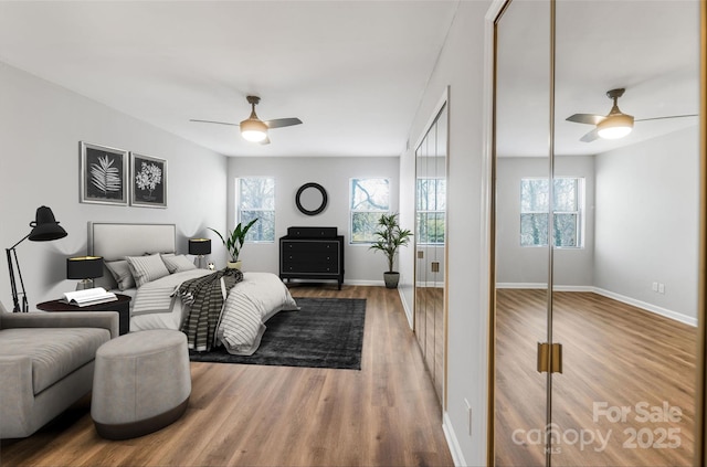 bedroom featuring wood-type flooring and ceiling fan