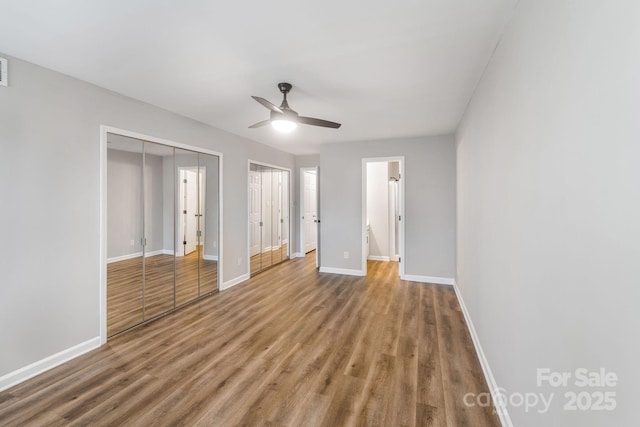 unfurnished bedroom with ceiling fan and hardwood / wood-style floors