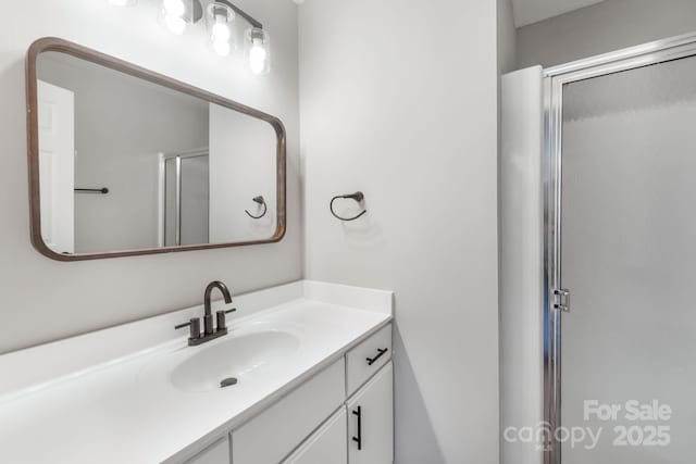 bathroom with vanity and walk in shower