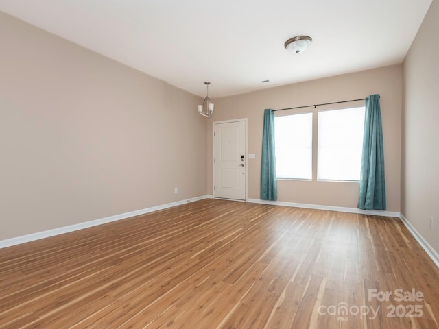 spare room with hardwood / wood-style flooring