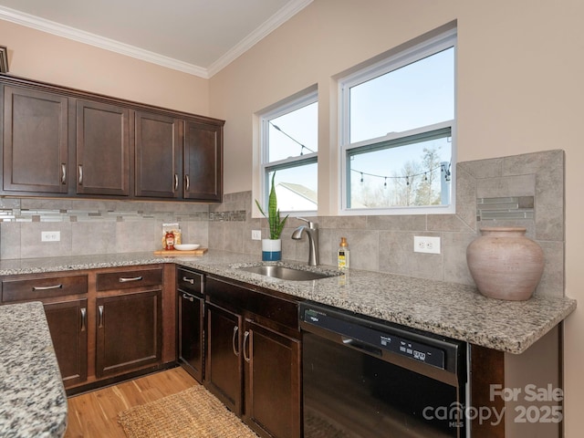 kitchen with dishwasher, sink, crown molding, light stone countertops, and light wood-type flooring