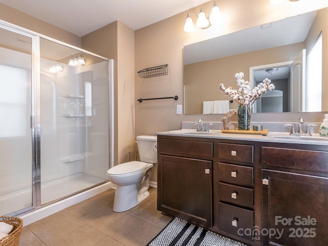 bathroom with walk in shower, vanity, toilet, and tile patterned flooring