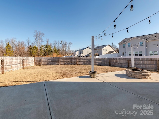 view of patio / terrace with an outdoor fire pit