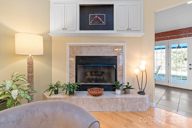 interior details with wood finished floors and a fireplace