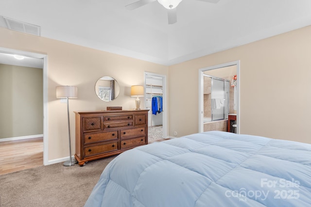 carpeted bedroom featuring baseboards, visible vents, ceiling fan, a spacious closet, and a closet