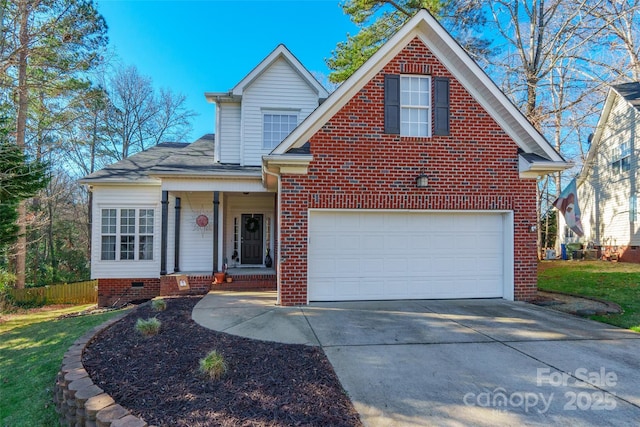 view of front property featuring a garage and covered porch