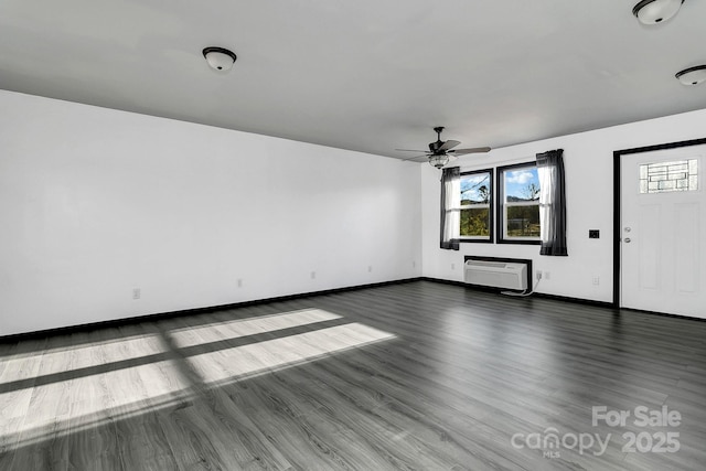 unfurnished living room featuring ceiling fan and dark hardwood / wood-style flooring