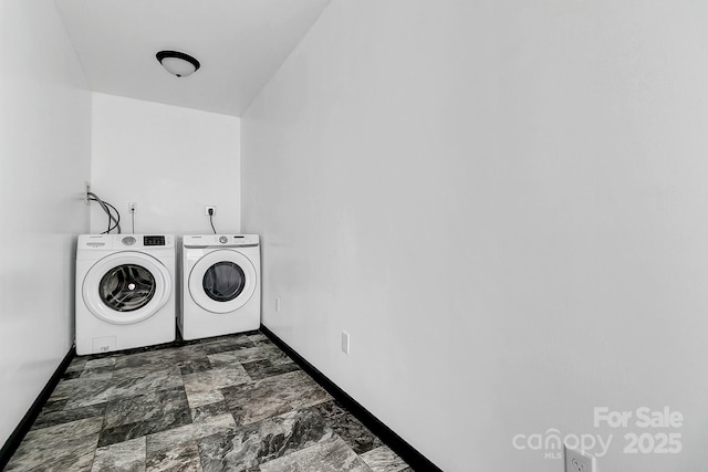 clothes washing area with washing machine and clothes dryer