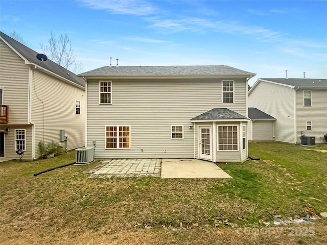 back of property featuring central AC, a patio, and a lawn