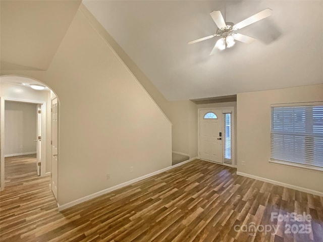 foyer with lofted ceiling, dark hardwood / wood-style floors, and ceiling fan