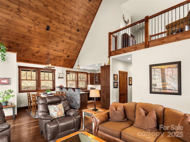 living room with dark wood-type flooring, wood ceiling, and high vaulted ceiling