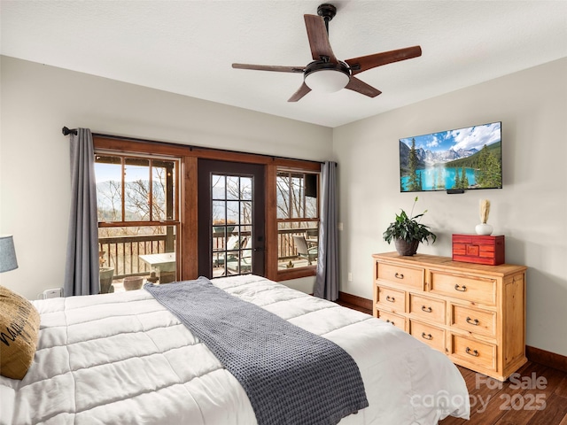 bedroom featuring dark hardwood / wood-style flooring, access to exterior, and ceiling fan