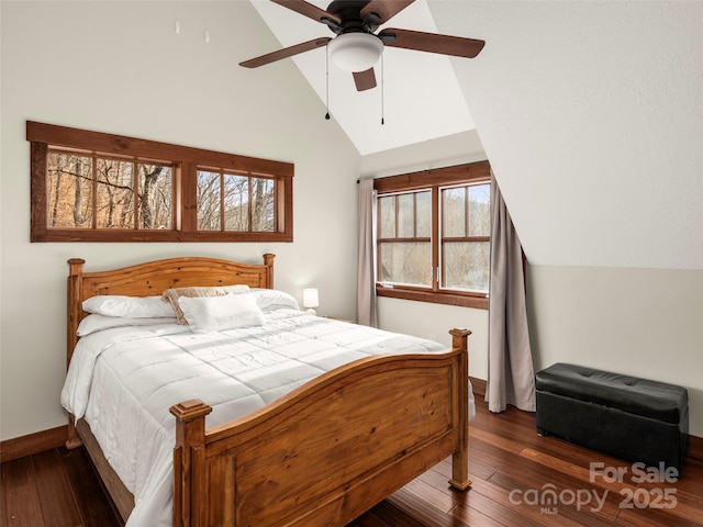 bedroom with vaulted ceiling, dark hardwood / wood-style floors, and ceiling fan