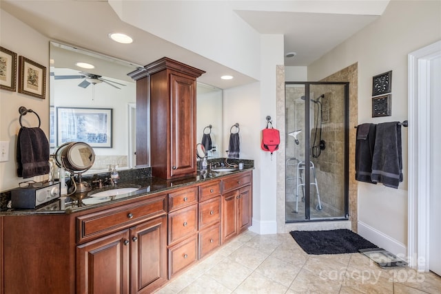 bathroom featuring vanity, tile patterned flooring, ceiling fan, and walk in shower