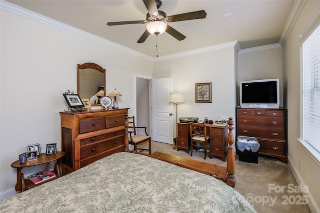 carpeted bedroom with crown molding and ceiling fan