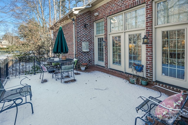 view of snow covered patio