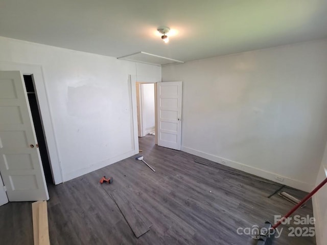 unfurnished bedroom featuring dark wood-type flooring