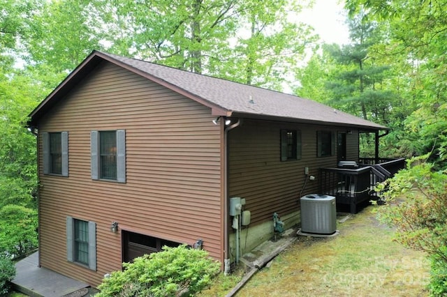 view of side of property with central AC