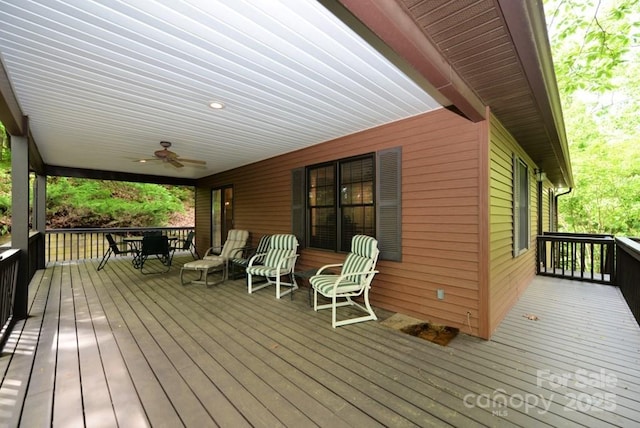 wooden deck with ceiling fan