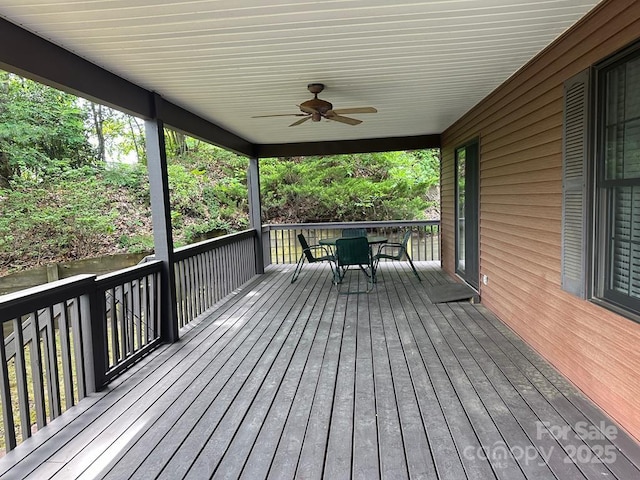 wooden terrace featuring ceiling fan