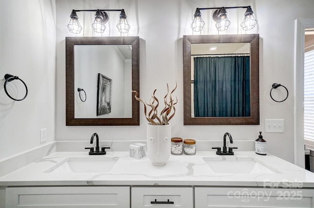 bathroom with vanity and a wealth of natural light