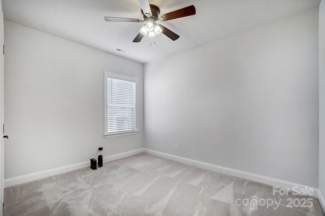 empty room featuring light carpet and ceiling fan