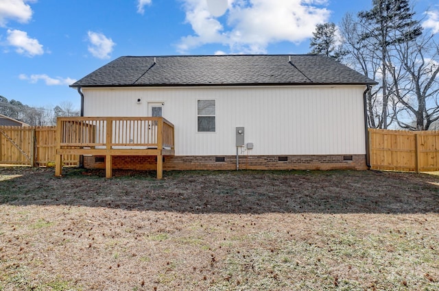 rear view of property featuring a deck