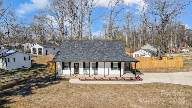 view of front of house featuring a front yard and covered porch