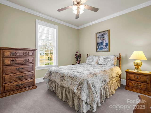 bedroom featuring multiple windows, ornamental molding, light colored carpet, and ceiling fan