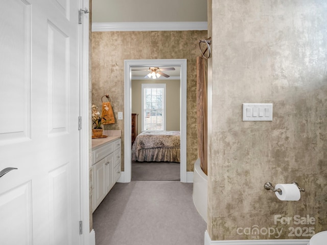 bathroom with vanity and crown molding