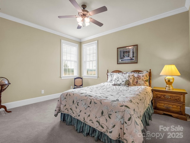 carpeted bedroom with ceiling fan and ornamental molding