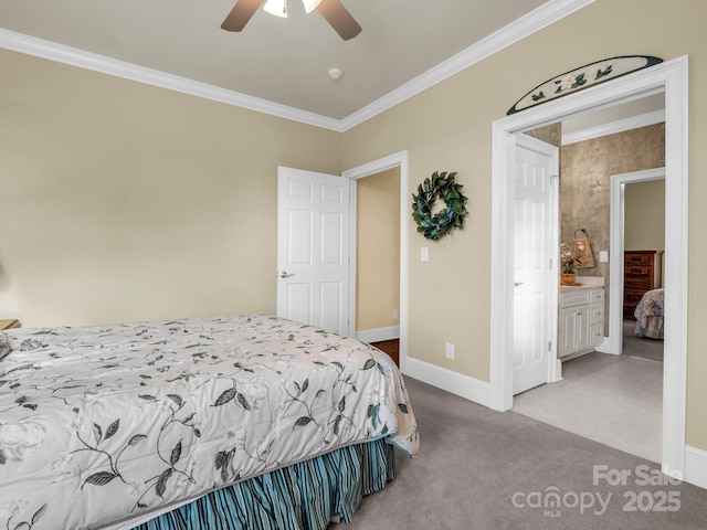 bedroom featuring ensuite bath, ornamental molding, light colored carpet, and ceiling fan