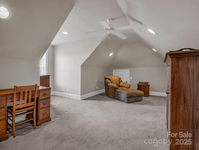 carpeted home office featuring vaulted ceiling and ceiling fan