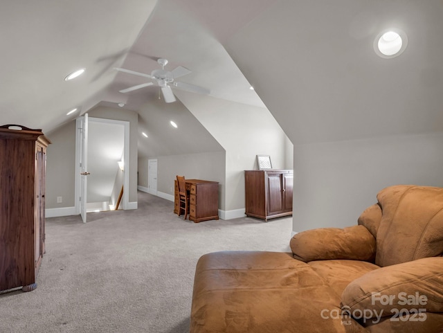 interior space featuring lofted ceiling, light colored carpet, and ceiling fan