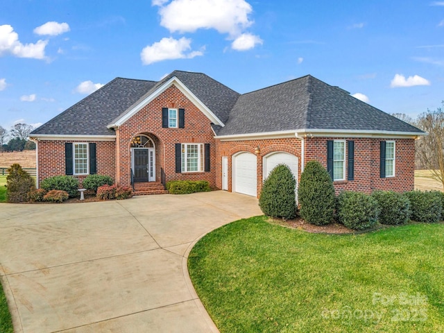 view of front property with a garage and a front yard