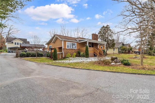 view of front of home featuring a garage and a front yard