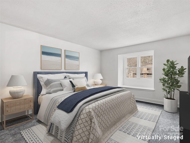 bedroom featuring a textured ceiling and baseboards