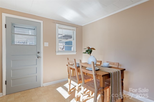 dining room featuring ornamental molding