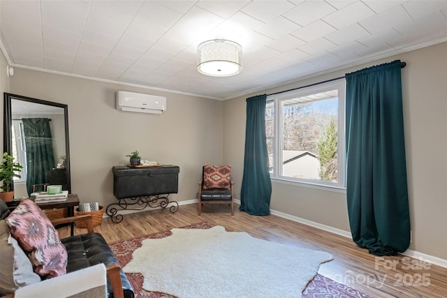 living area with crown molding, wood-type flooring, and a wall mounted air conditioner