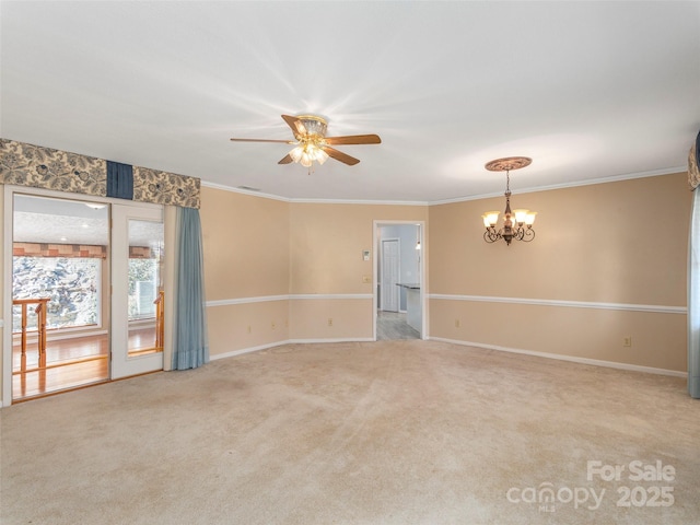 spare room with baseboards, light carpet, ornamental molding, and ceiling fan with notable chandelier