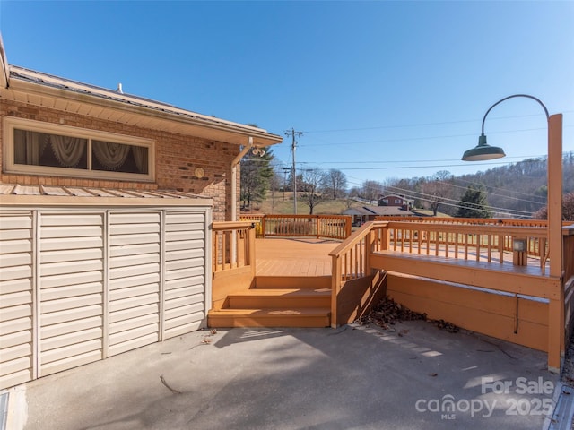 wooden deck featuring a patio area