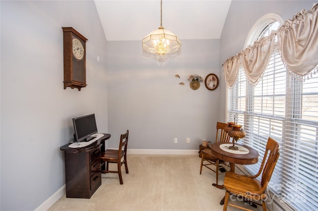 carpeted home office featuring a notable chandelier and vaulted ceiling