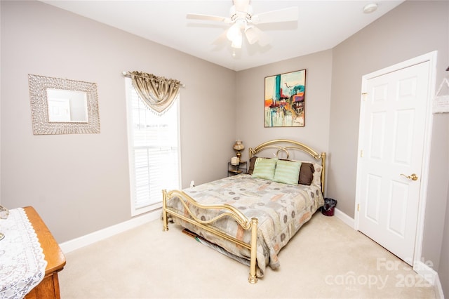 bedroom with multiple windows, ceiling fan, and carpet