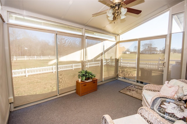 sunroom / solarium with vaulted ceiling and ceiling fan