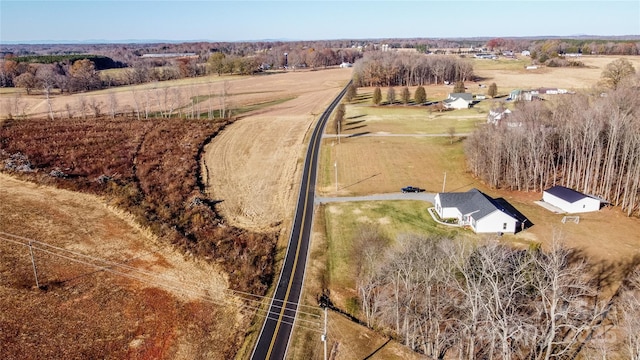 birds eye view of property with a rural view