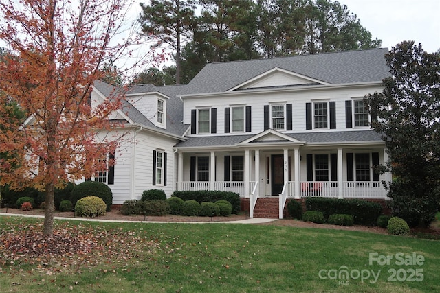 view of front facade featuring a porch and a front yard