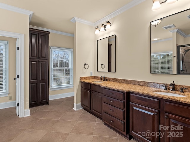 bathroom featuring ornamental molding, tile patterned flooring, and vanity