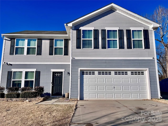 front of property with a garage