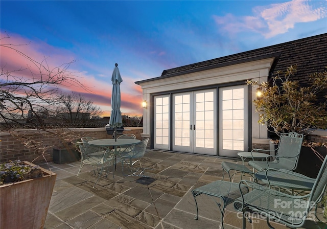 patio terrace at dusk with french doors