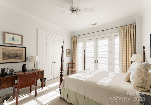 bedroom featuring light carpet, access to outside, ornamental molding, a closet, and ceiling fan